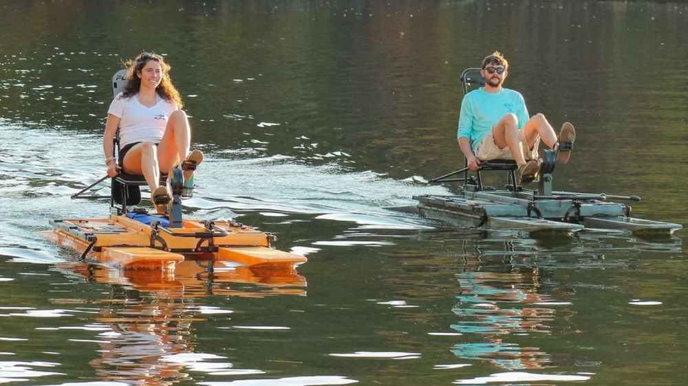 two people pedaling across the lake on the Flip-Kat®