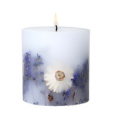 Inclusion candle with floral arrangement.