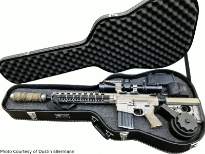 Cedar Mill guitar case opening to reveal a rifle inside