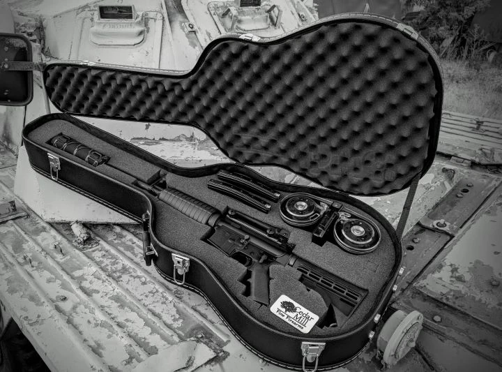 Cedar Mill Discreet Rifle Guitar Case holding a rifle in custom-cut foam