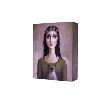 Printed Wooden Block in Grey: Dark long haired lady with green shirt and cross necklace holding a Grey Siamese Cat with flower crown in her hair on a brownish grey background. 