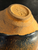 2.	Chawan:  A tenmoku-style tea bowl with a dark iron-rich hare’s-fur glaze.