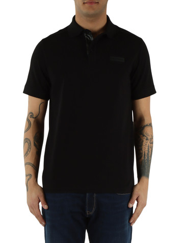 NERO | Polo in cotone stretch con patch logo frontale