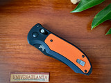 Benchmade AUTO AXIS Triage Rescue Folder ~  Black Combo Blade, Aluminum with Orange G10 Inlays