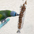 Parrot Pecking at Millet from Holder with Bell