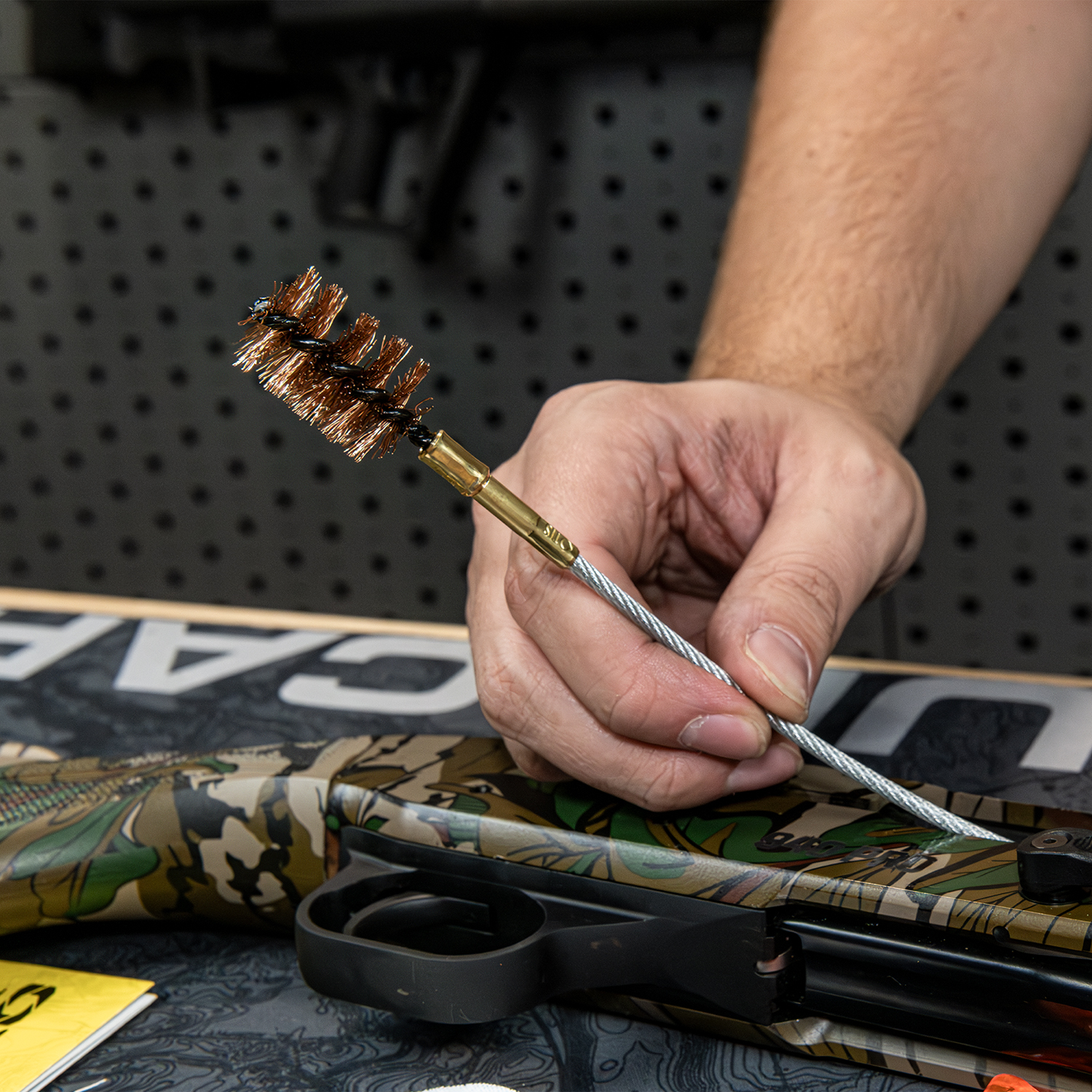 Lifestyle image of Otis Technology Universal Shotgun Cleaning kit cable and bronze bore brush in use