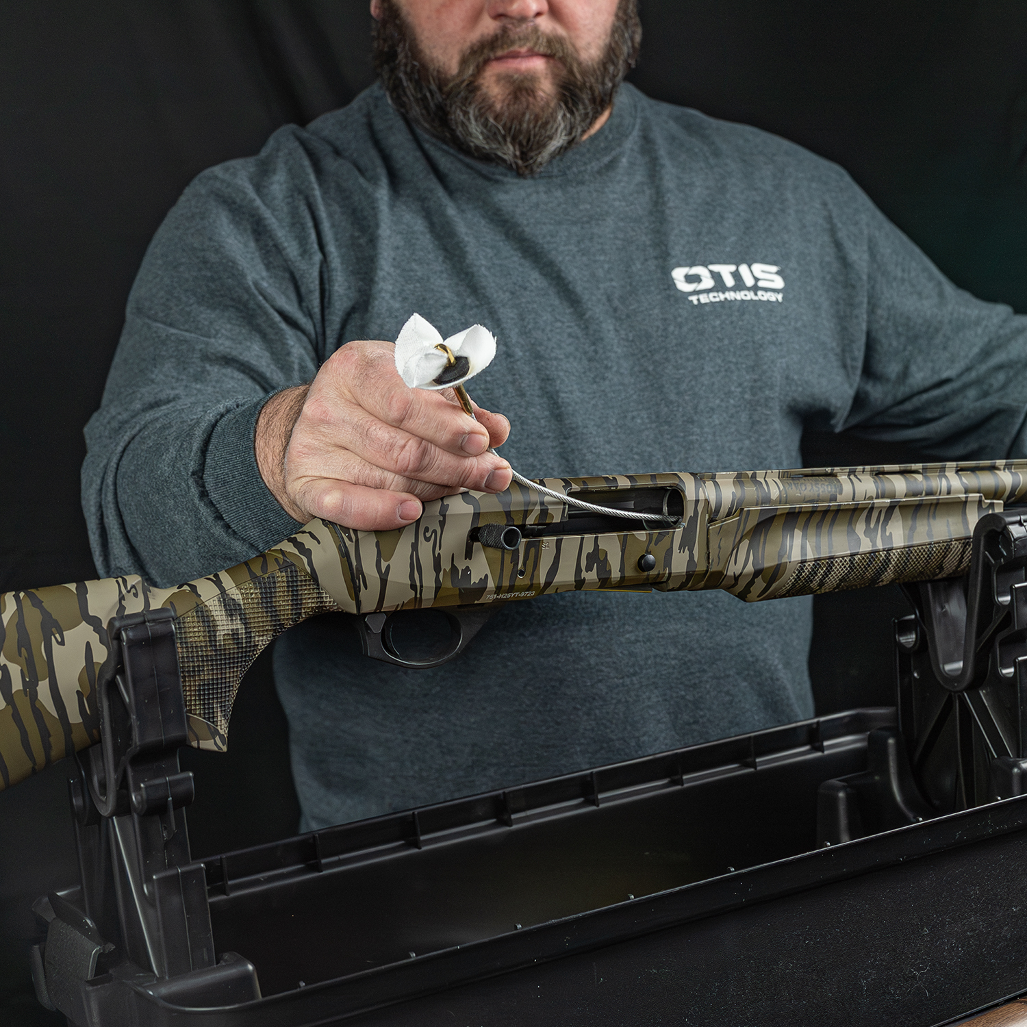 LIfestyle image of Otis Elite Range Box, Universal Gun Care System on a Spandau 12 gauge shotgun