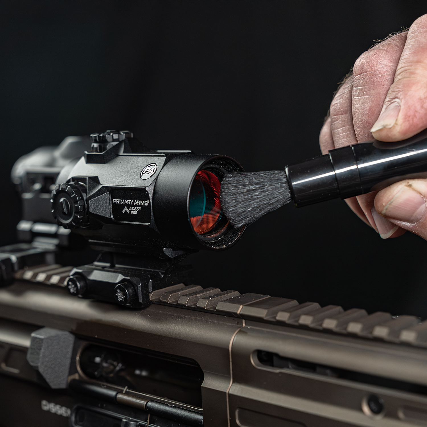 Lifestyle image of Otis Technology AR Elite Range Box Gun Care System for .223/5.56 lens cleaning brush shown in use