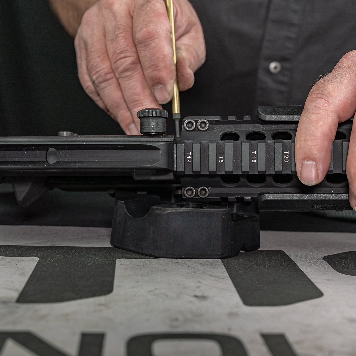 Lifestyle image of Otis Technology AR Elite Range Box Gun Care System for .223/5.56 pin punch shown in use