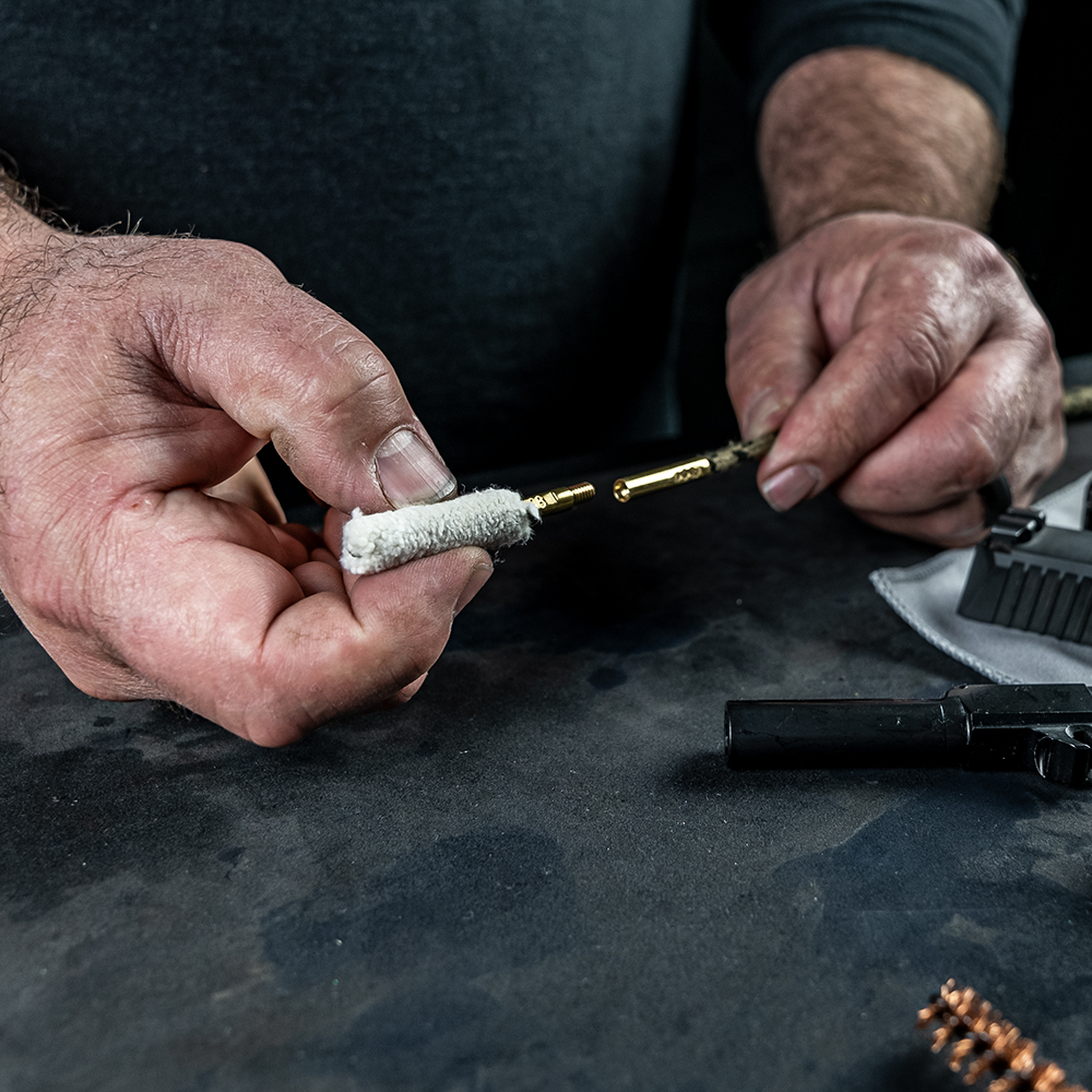 Product image of Otis Technology .38 Caliber/9mm Bore Mop being threaded onto Ripcord