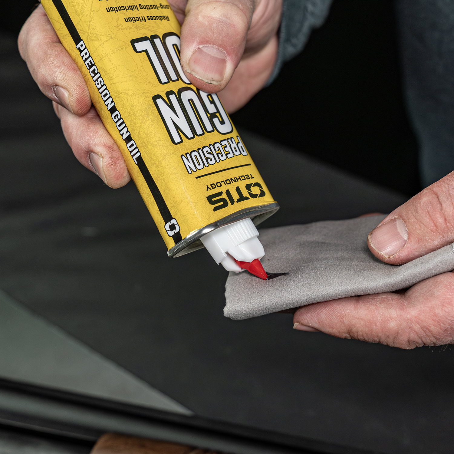 Lifestyle image of Otis Technology Precision Gun Oil 4oz tin in use 