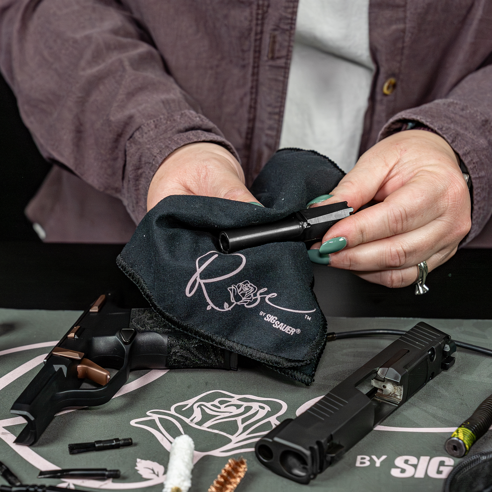 lifestyle image of  image of Otis Technology ROSE™ by Sig Sauer 9mm Cleaning Kit in use