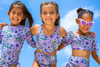 Three girls in Shade Critters Mod Purple Floral Cinched Girls Monokini Swimsuit