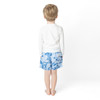 fit point of view of Shade Critters Denim Paradise boys  kids swimsuit trunks on boy with tropical blue print 