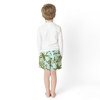 Back view of boys Mint Tropics swim trunks on model with elastic waistband.