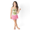 Girls tropical print one piece swimsuit with pink fringe skirt on model showing fit.