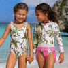 Shade Critters Cute Girls blush tropics one-piece featuring lush palms and aqua florals.