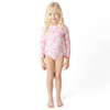 Girls Pink Paradise long sleeve one piece swimsuit on model showing fit.