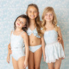Tween girls blue ruffle bikini set with shell trim detail, coordinated kids swimwear shown on models.