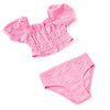 Girls pink eyelet two piece swimsuit with puff sleeve top and coordinating bottoms, soft textured kids swimwear.