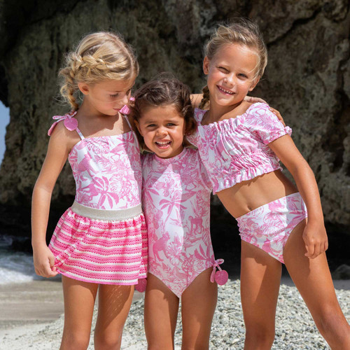Girls wearing the Shade Critters Pink Paradise smocked one piece and crochet skirt swim set.