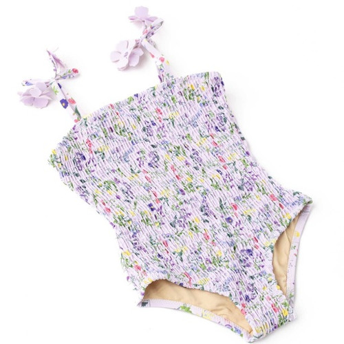 Full front view of the Shade Critters smocked one-piece highlighting the textured body and cheerful multicolor floral print.