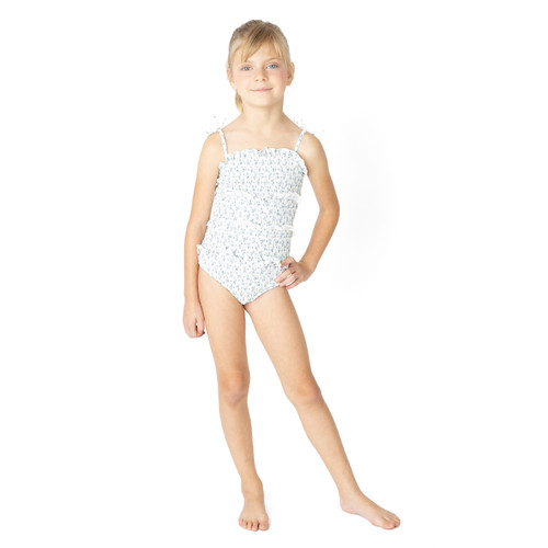 Girls Cottage Floral Blue smocked one piece swimsuit on model showing fit and length.