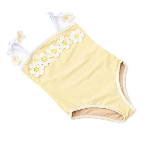 The back of the Shade Critters Butter Daisy swimsuit displays smooth yellow fabric with white shoulder straps and coordinating white trim around the neckline and leg openings.