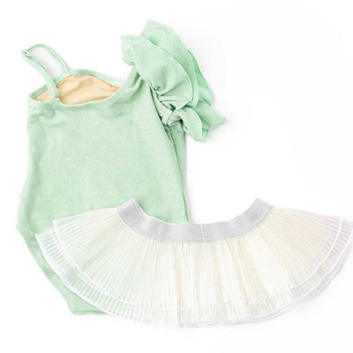 The full Shimmer Mint swimsuit by Shade Critters laid flat, paired with the pleated tutu skirt. The textures and shimmer of the fabric are easy to see, emphasizing its playful, dress-up-ready style.