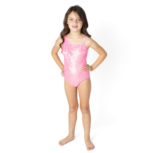 Girls pink one shoulder one piece swimsuit on model showing fit.