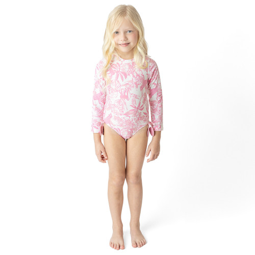 Girls Pink Paradise long sleeve one piece swimsuit on model showing fit.