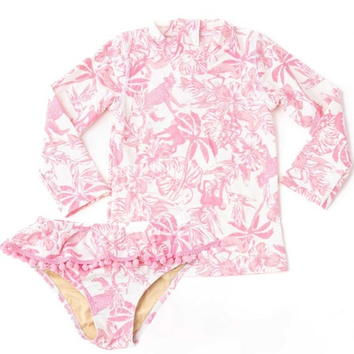 The Shade Critters Pink Paradise Girls Rashguard Swim Set displayed flat, showing the long-sleeve top and pom-pom trimmed bottoms in the pink tropical print.