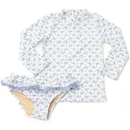 The Shade Critters Cottage Floral Blue Girls Rashguard Swim Set displayed flat, showing the blue floral-print top with matching ruffled, pom-pomtrimmed bottoms.