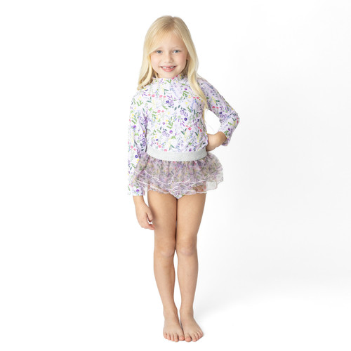 Girls Wildflower Fields rashguard swim set on model showing fit.