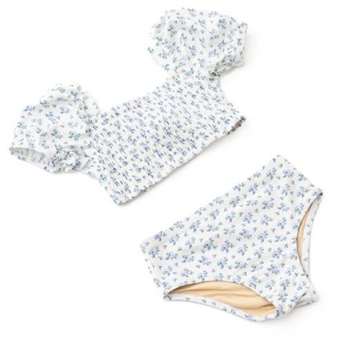 Front View: A full front view of the Shade Critters two-piece showing the smocking and blue floral pattern. 