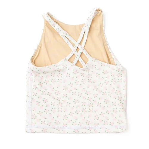 Girls pink floral active tank with crisscross back straps and comfortable fit, stylish kids activewear.