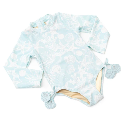 Girls blue long sleeve one piece swimsuit with soft stretch fabric and tassel accents, stylish kids swimwear for sun protection.