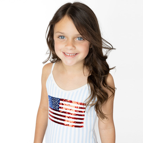 Girls striped swimsuit with sequin American flag detail, patriotic kids swimwear close-up on model.