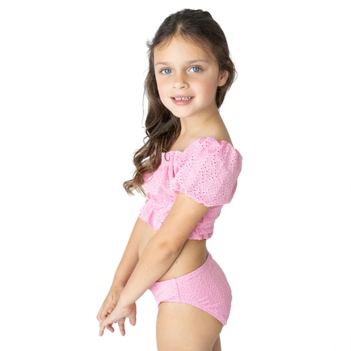Shade Critters girls eyelet smocked bikini set in pink with puff sleeve top, stylish kids swimwear shown on model.