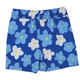 Boy wearing Shade Critters Blue Daisy Boys 4 Way Stretch Swim Trunk