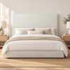 Lucca ivory upholstered bedhead, front view in a warm neutral bedroom