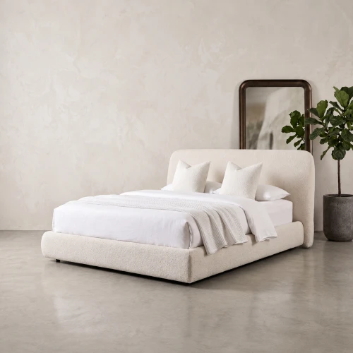 Raveena curved upholstered bed frame in a cream bedroom, square product cover
