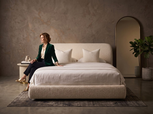 Front view of Raveena upholstered bed frame and rounded padded headboard