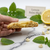 Close up of Lemon Balm-Shell artisan cookie broken in half showing herbal lemon balm curd center by In The Black Cookie Co.