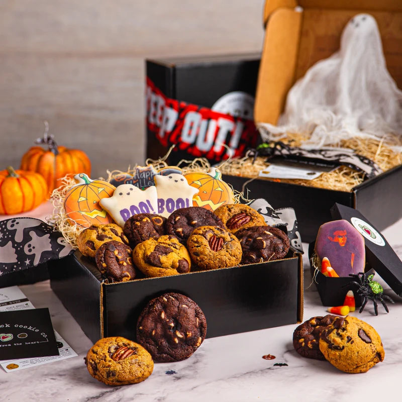 Boo Box of cookies with frosted ghost and pumpkin cookies, mini pumpkins and Halloween decorations