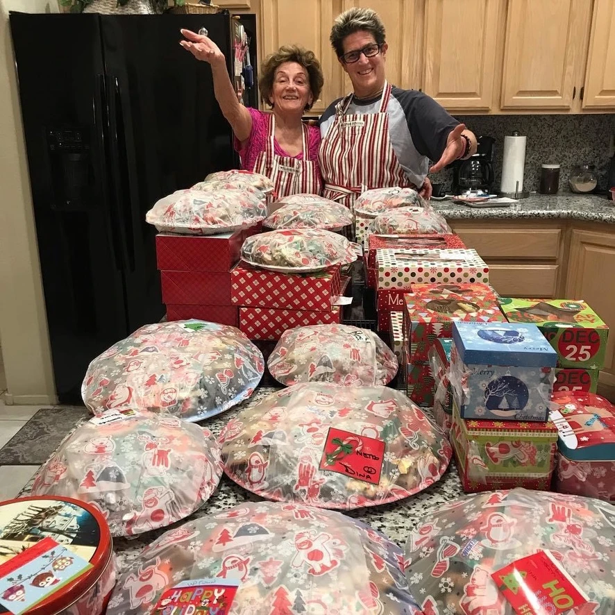 Marian and Dina with holiday cookie platters