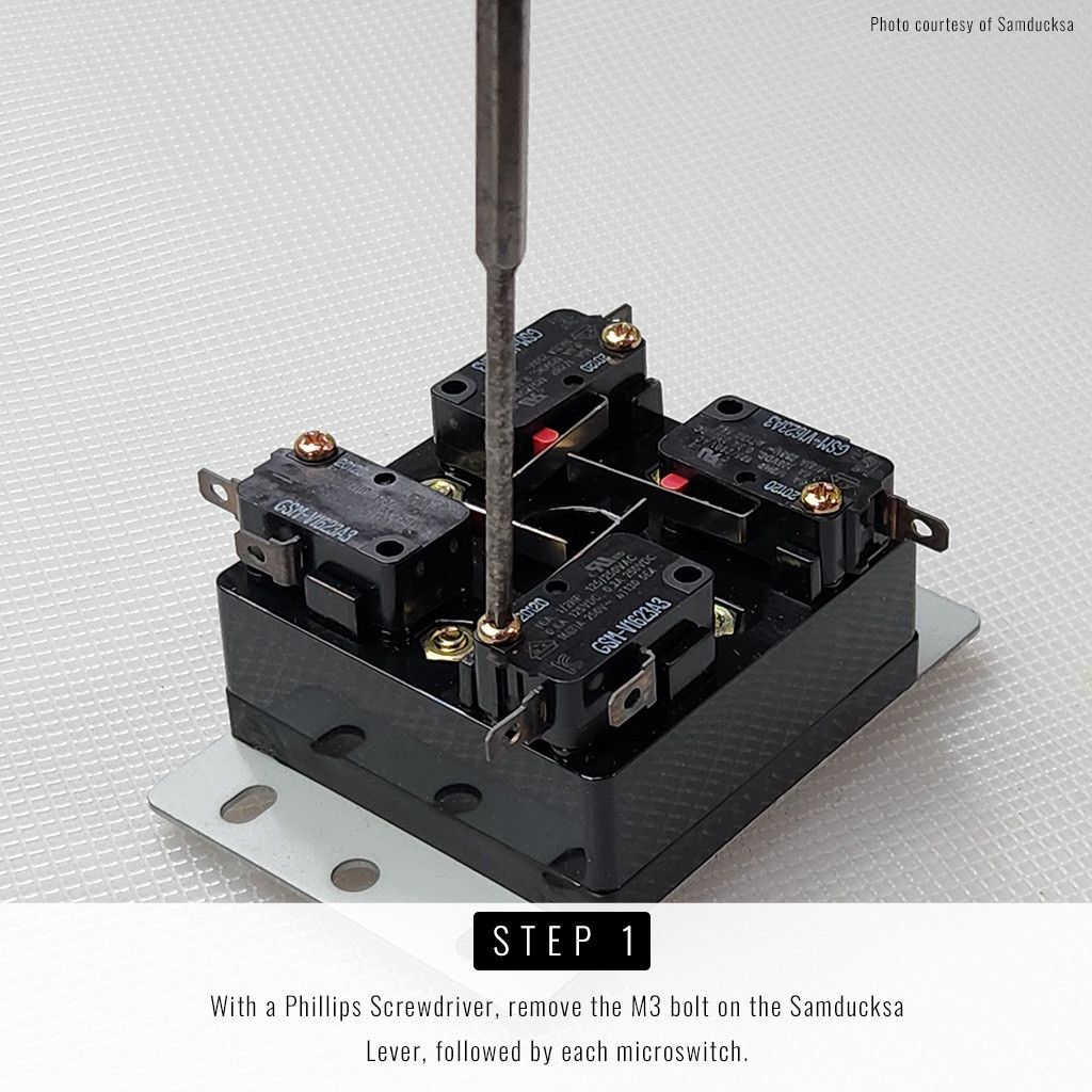 Step 1: With a Phillips Screwdriver, remove the M3 bolt on the Samducksa Lever, followed by each microswitch.