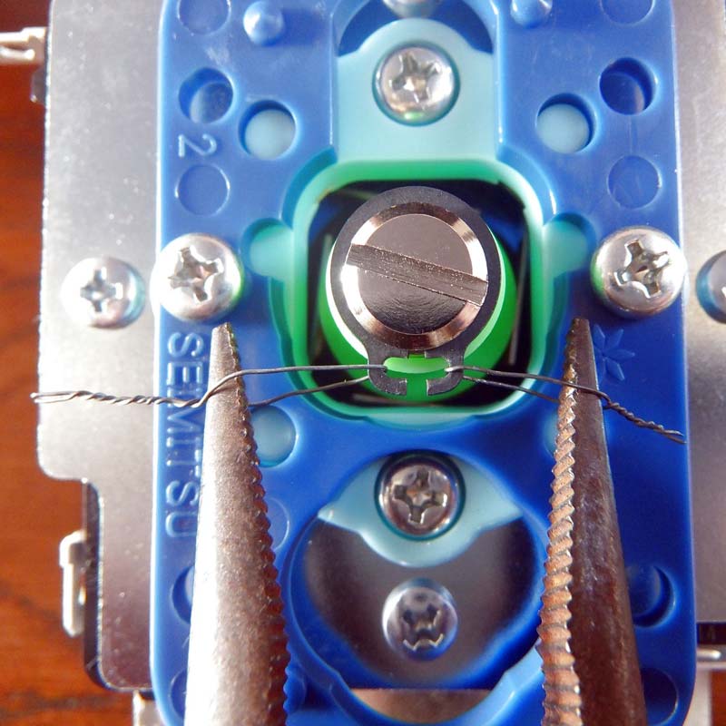 Step 4: Pull the needle-nose plier handles