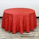 120-inch round red crinkle taffeta tablecloth draped over a round table.
