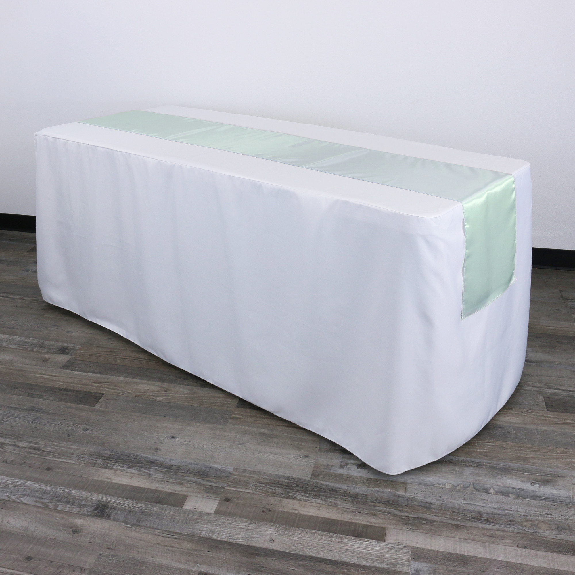 14 x 108 inch Satin Table Runner Mint on a rectangular table